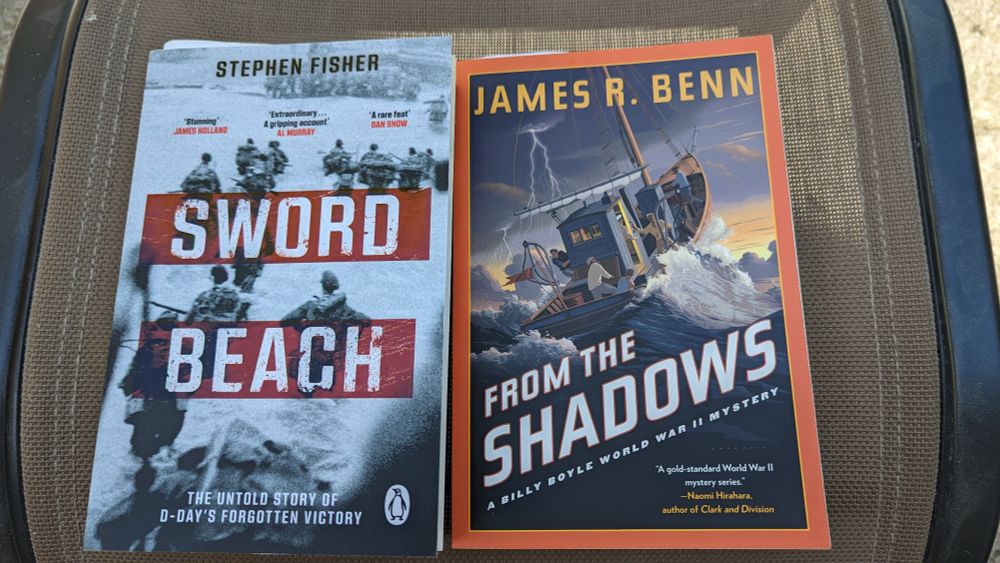 This is a picture of the 2 books mentioned in the post. They are on my patio sitting on the footrest from that set of patio furniture we bought many years ago. The chairs were crap so we sold them at a garage sale and kept the table and footrests. 