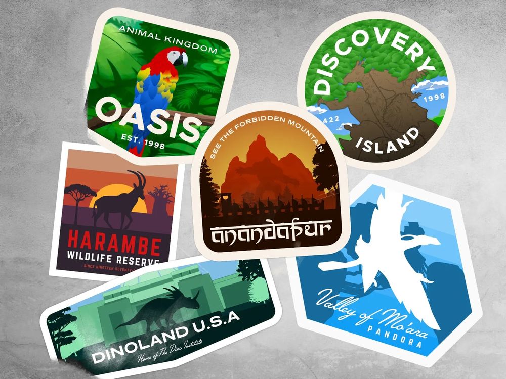 A collection of travel stickers themed to Disney’s Animal Kingdom. Left to right top to bottom: an oasis sticker featuring a mace, a Discovery Island sticker featuring the Tree of Life, a Harambe Wildlife Reserve with an Oryx, Anandapur with the Forbidden Mountain and train silhouette, Dinoland USA with the Dino Institute and styracosaurus silhouette, and finally a Valley of Mo’ara sticker with a knockout Banshee silhouette. 