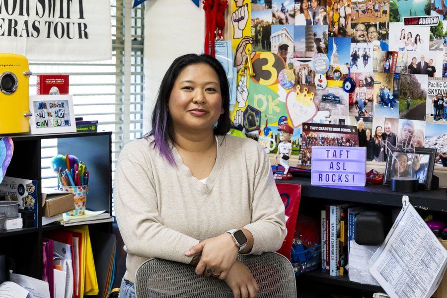 Arby posing for a photo in her classroom.