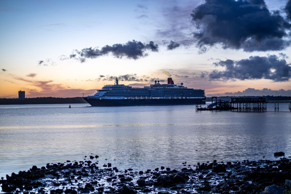 Cruise Ship Queen Victoria heading into Southampton Docks just before sunrise
