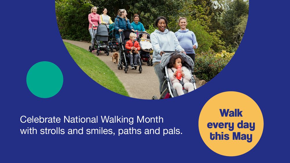 A blue promotional graphic with an image of a large group of mothers and their buggies. They smile or talk as they walk through a local park as a part of a group buggy walk. The image is set on a navy blue background with two circles of yellow and green and text reading "Celebrate National Walking Month with strolls and smiles, paths and pals".