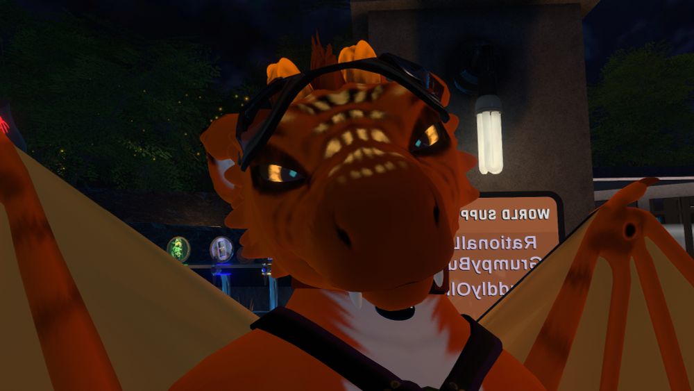 An orange moonfang with wings, head cocked to the side, looking at the viewer with narrowed eyes.