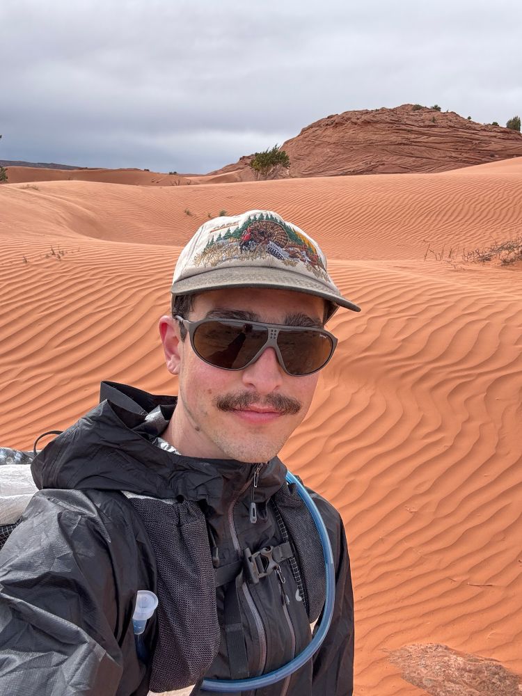 backpacking in the desert amongst the sand dunes