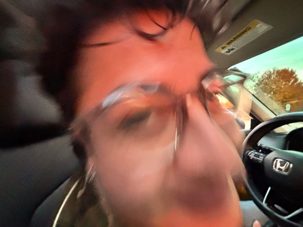 a blurry close up photo of someones face