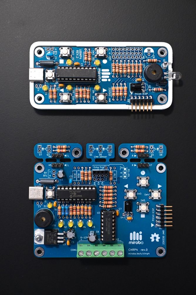 A UBMP4 (top) educational PICmicro development board and its robot-focused CHRP4 (bottom) sibling. 