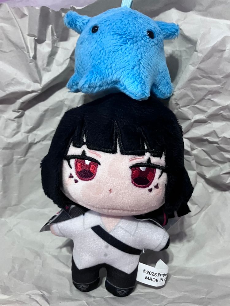 ryoshu nui with a blue octopus plushie on her head