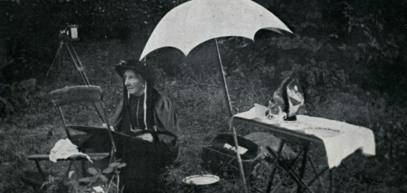 A photo of Margaret Stokes recording archaeological observations outside. 