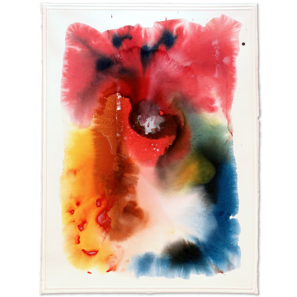 A colorful stain painting on a large sheet of Arches Watercolor Paper of abstract shapes in rose, yellow, brown and blue and black in an organic swirling composition.