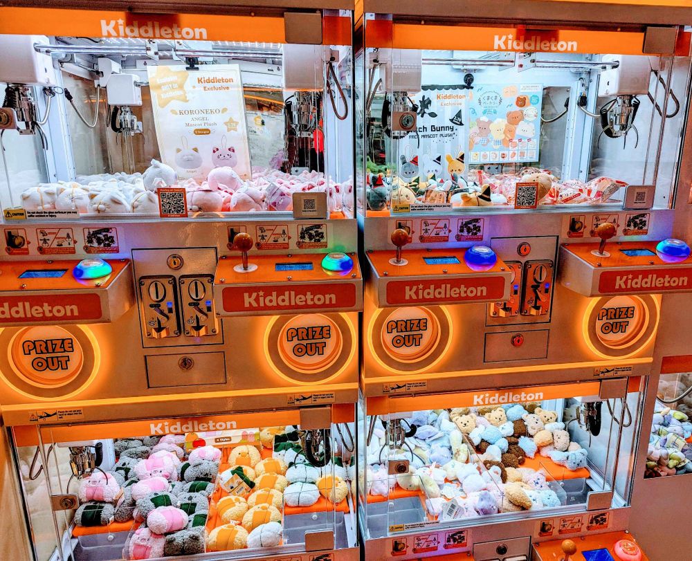 claw machines with miniature stuffed toys inside