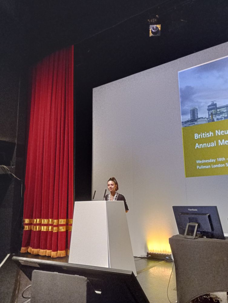 Lillie Pakzad-Shahabi on stage at the BNOS2035 conference, about to present her work on PPIE in the PEAR GLIO trial