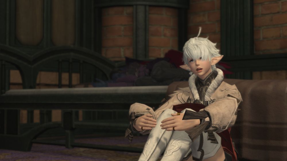 A picture of Alisaie, sitting on the floor beside a bed that Sari is sleeping in. Alisaie has a tear in her eye as she talks to Sari.