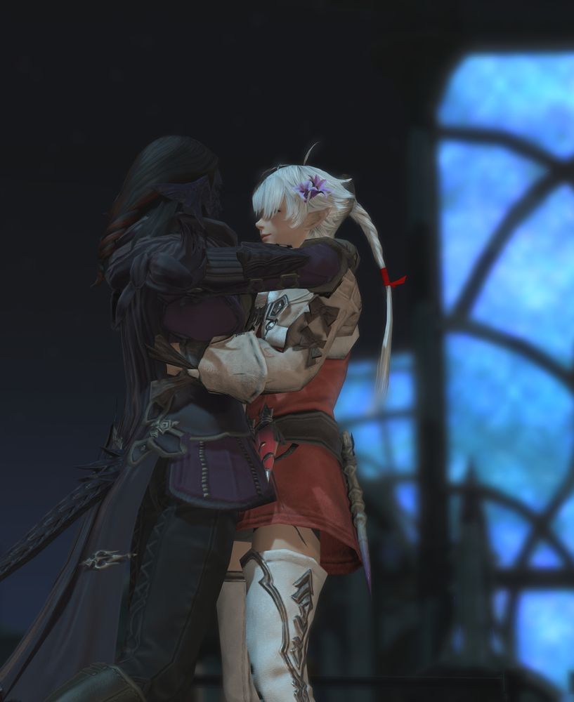 A picture of Sari and Alisaie dancing in the Crystarium at night. Alisaie has her arms wrapped around Sari's waist while Sari has her arms wrapped around Alisaie's shoulders.