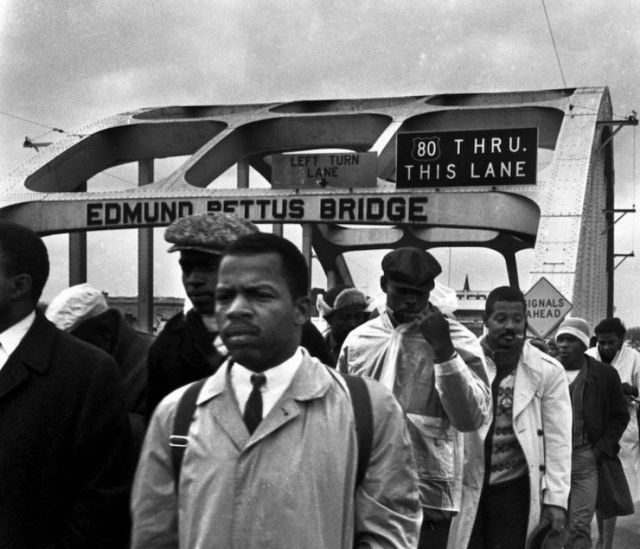 Photo Of John Lewis leading marchers across the Edmund Pettus Bridge

