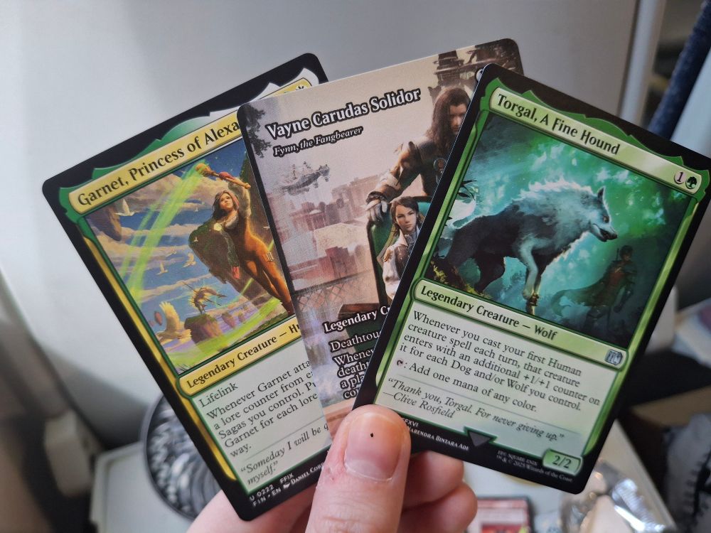 three of my wanted final fantasy magic the gathering cards - garnet, a full art vayne, and a torgal, a fine hound