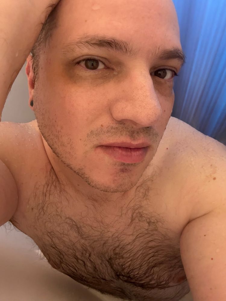 Shirtless guy (naked) in shower