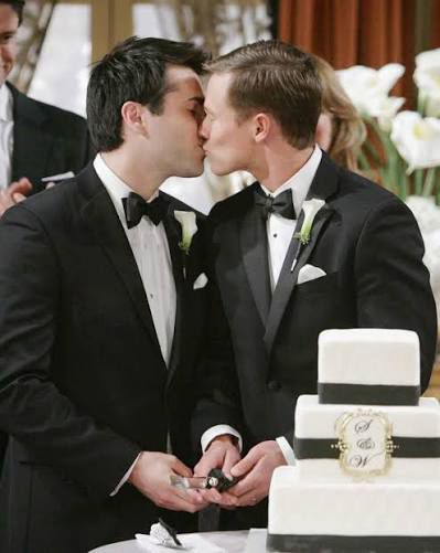 Sonny and Will kissing before slicing their wedding cake