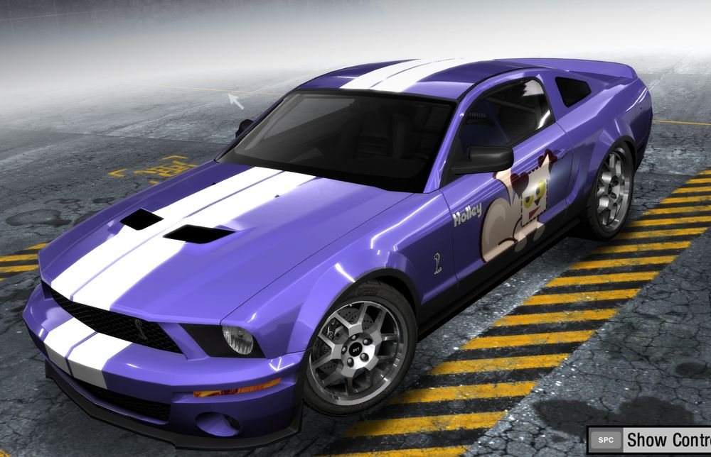 A different view of the same muscle car. It's blurple with a pair of white racing stripes across top.