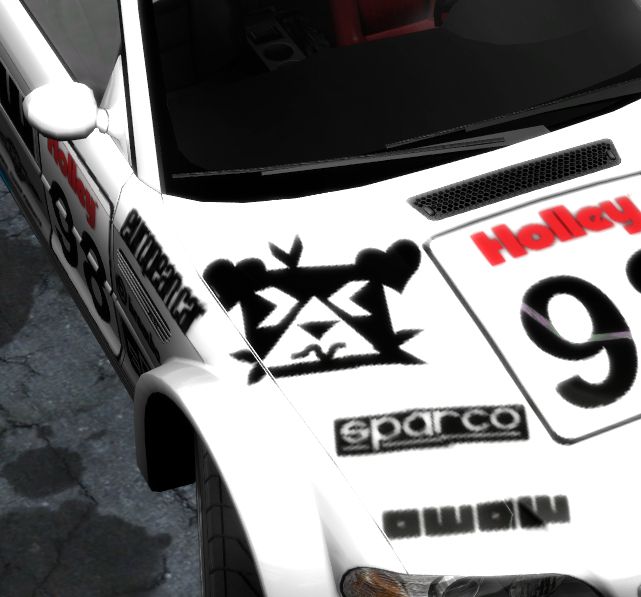 A screenshot of Need For Speed prostreet of the BMW livery's hood, depicting Hollie's face scrunching up.