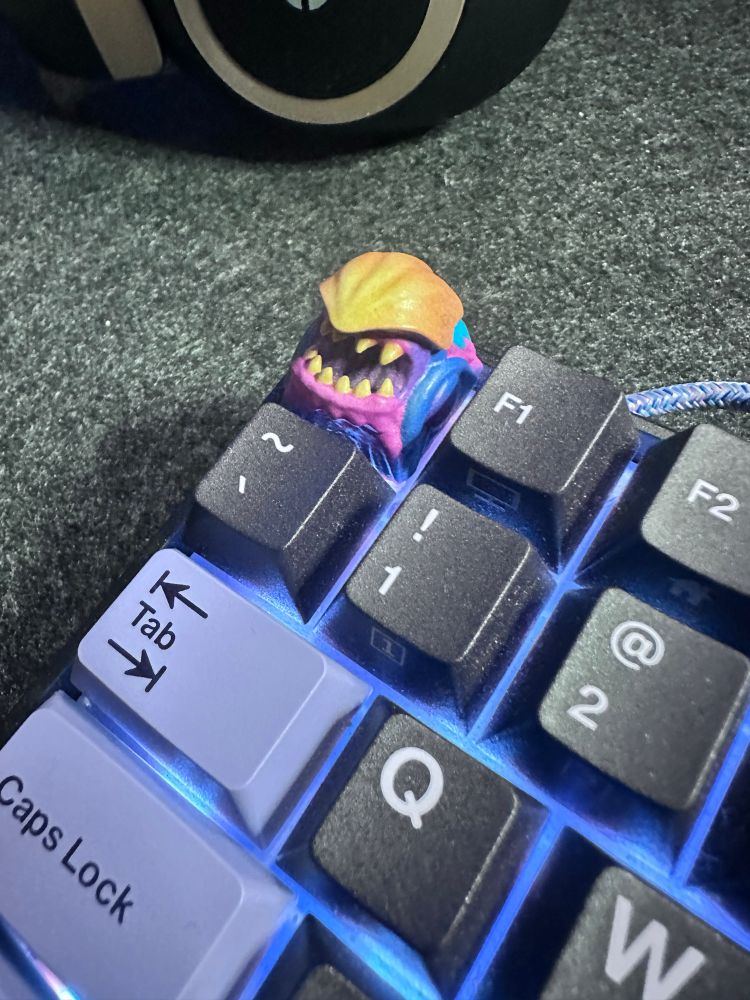 A monster themed key cap designed by Brock Hofer on a keyboard. 