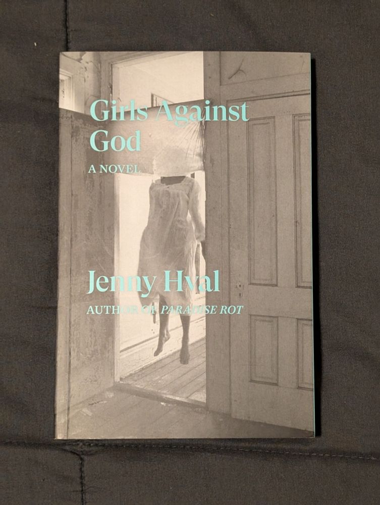 Girls against God by jenny hval

The cover is a black and white photo showing a girl levitating in a door frame
