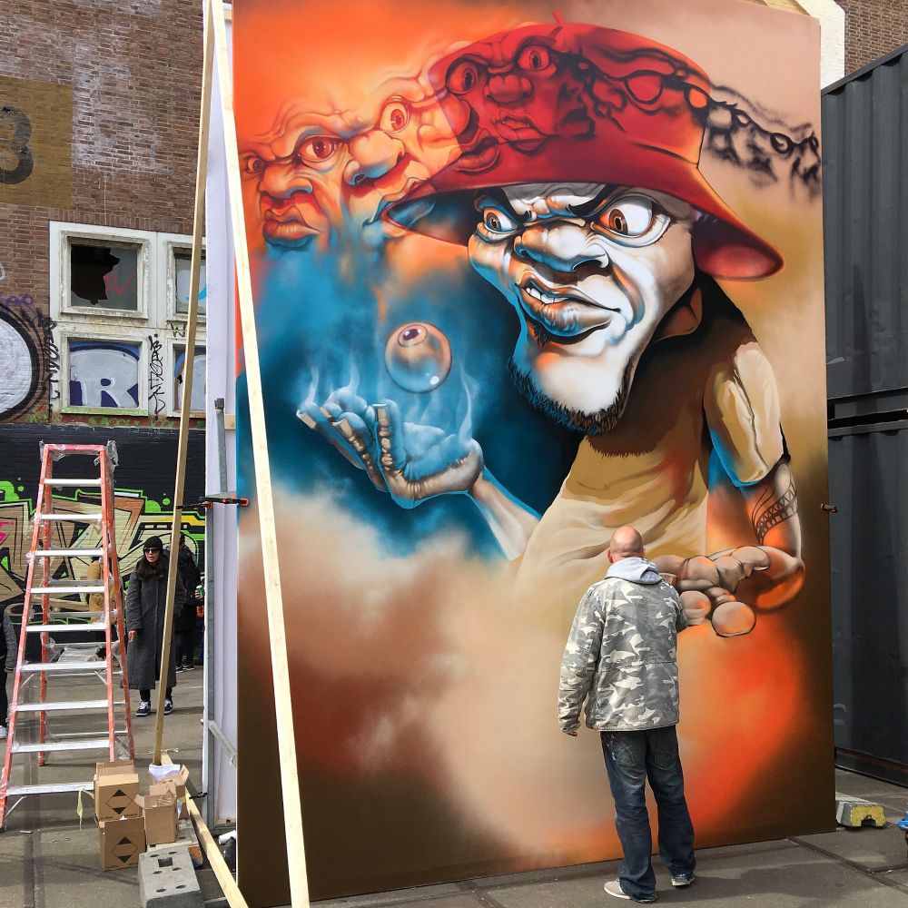 Artist Nash paints a canvas for Kings Spray curated by StreetArtToday at the NDSM in Amsterdam, The Netherlands. 