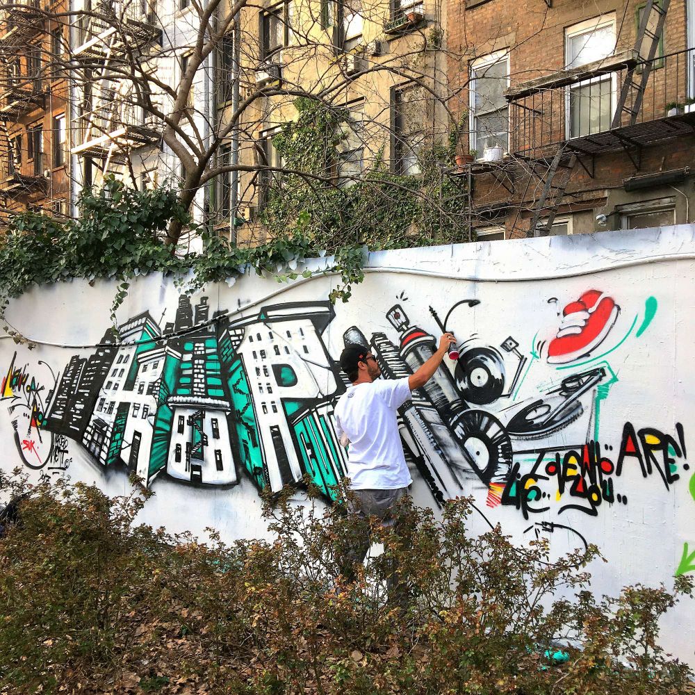 Artist Marcelo Ment paints a piece for International Hip-Hop Day in the East Village in Manhattan, New York. 