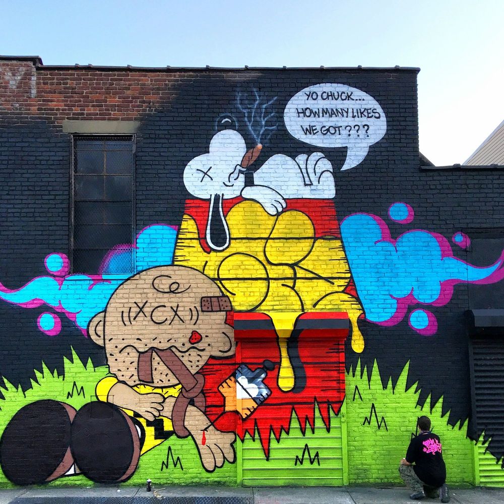 Artist Giz paints a mural for the Bushwick Collective in Bushwick in Brooklyn, New York. 