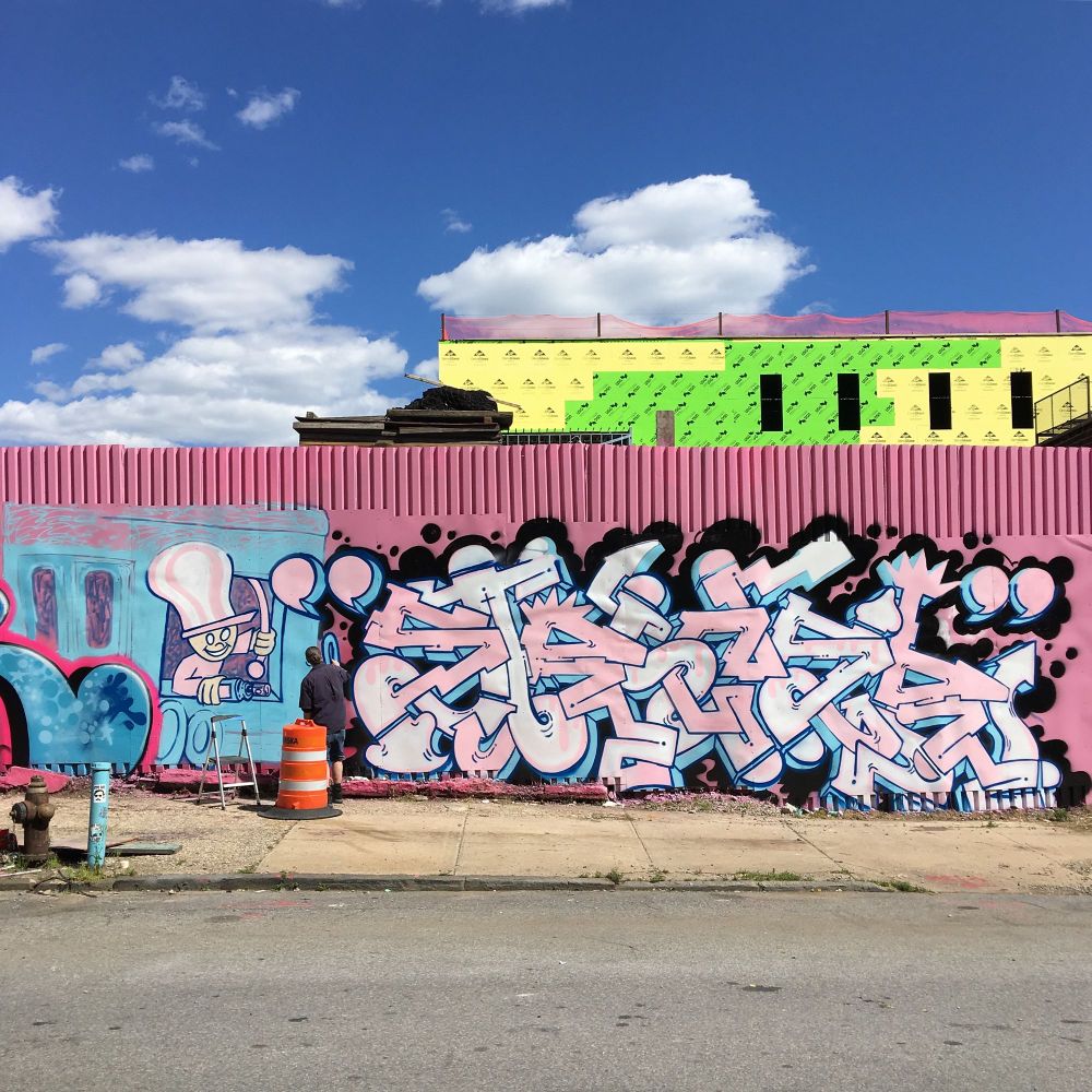 Artist Strider paints a piece for the Bushwick Collective in Bushwick in Brooklyn, New York. 
