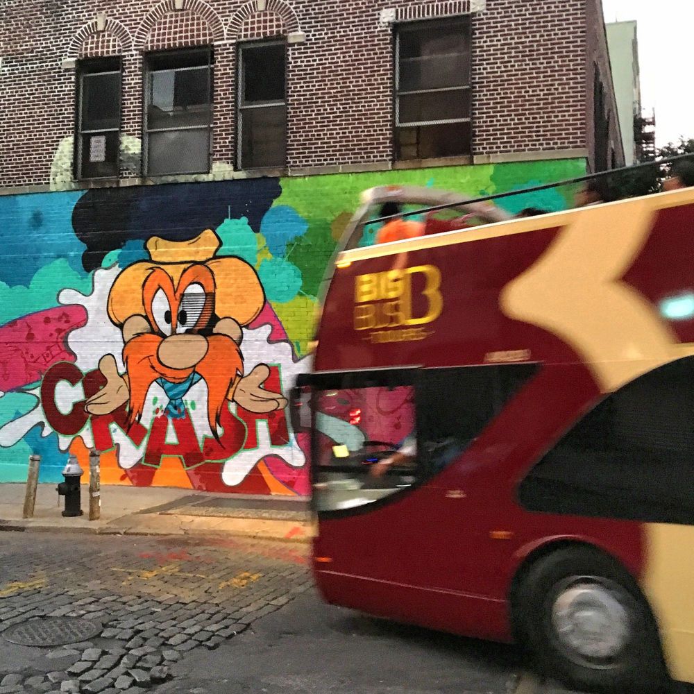 Big Bus almost crashes into a piece by Crash for the LISA Project in Chinatown in Manhattan, New York.