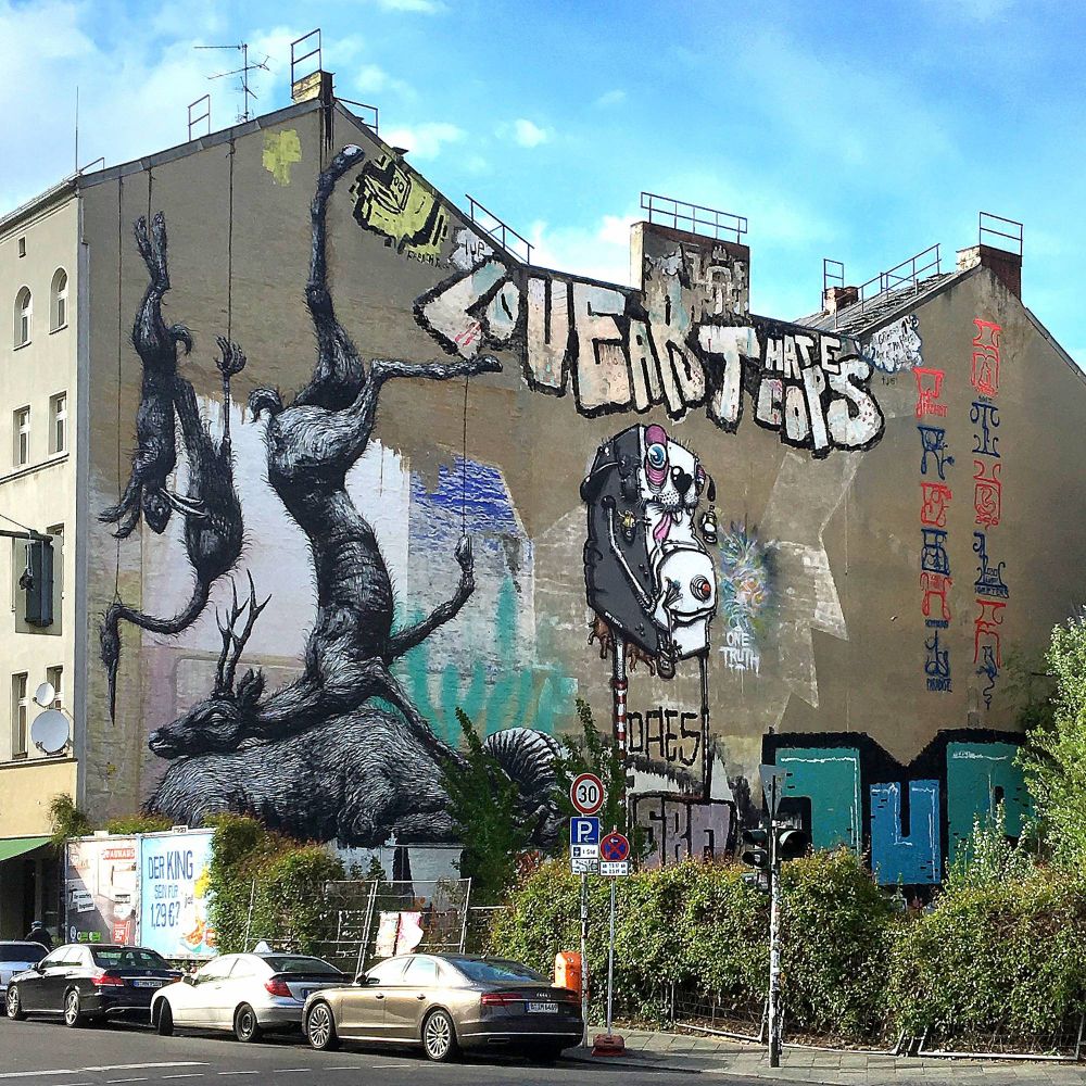 Mural by Roa and pieces by One Truth and 1UP and Berlin Kidz in Berlin, Germany. 