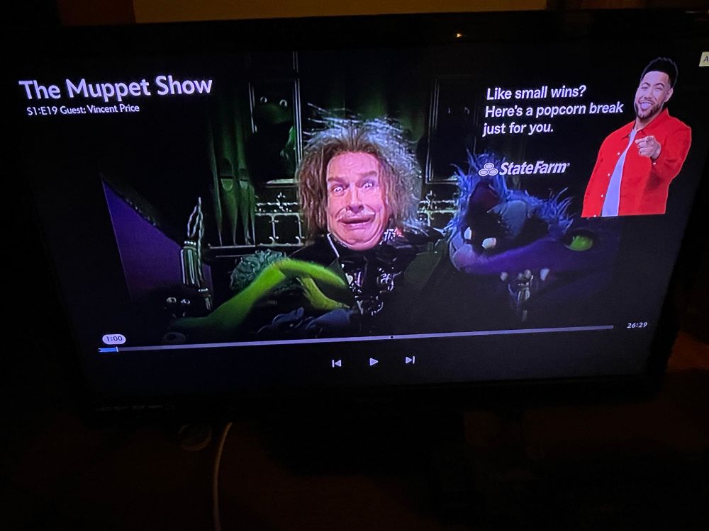 Screenshot of Vincent Price in character surrounded by monster Muppets 