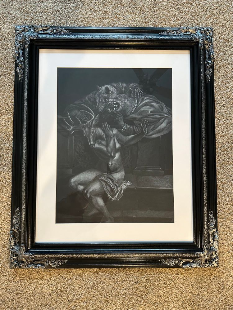 A drawing framed in an ornate black frame with silver filigree. The drawing is a copy of artemisia Gentileschi’s Susanna and the Elders with Susanna as a deer and wolves as the elders drawn in white pencil on black paper