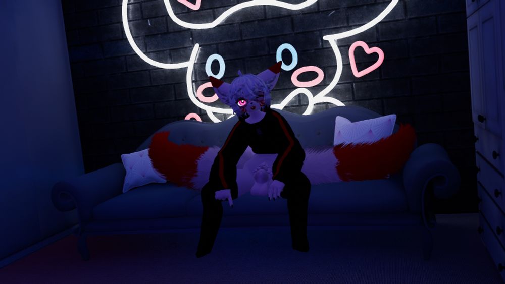 Flaze sits on the couch, blepping smugly~