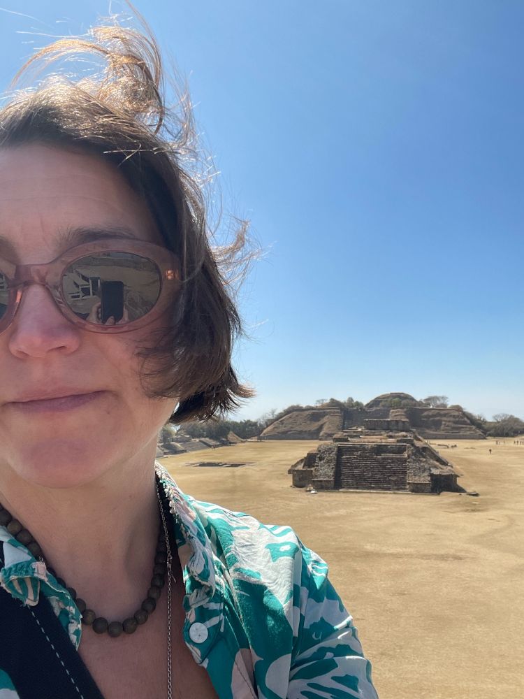 Selfie with part of the ruins of monte Albán in the background 