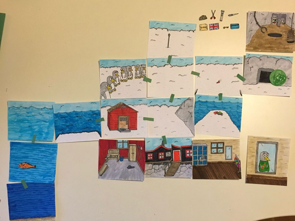 Series of index cards with hand drawn pictures of scenes in Antarctica with penguins, water, buildings, etc, laid out in a grid. 