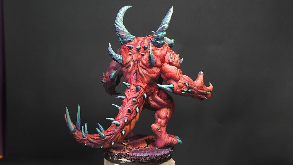 Diablo lord of terror. Red skinned demon miniature on lava base
