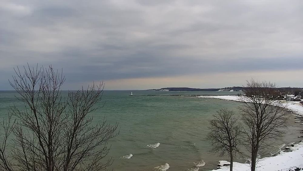 NE view from Sodus Lighthouse overlooking Sodus Point Passage and Lake Ontario. // Image captured at: 2025-12-17 16:00:16 UTC (about 1 min. prior to this post) // Current Temp in Sodus Point: 43.10 F | 6.17 C // Precip: overcast clouds // Wind: W at 9.216 mph | 14.83 kph // Humidity: 66%