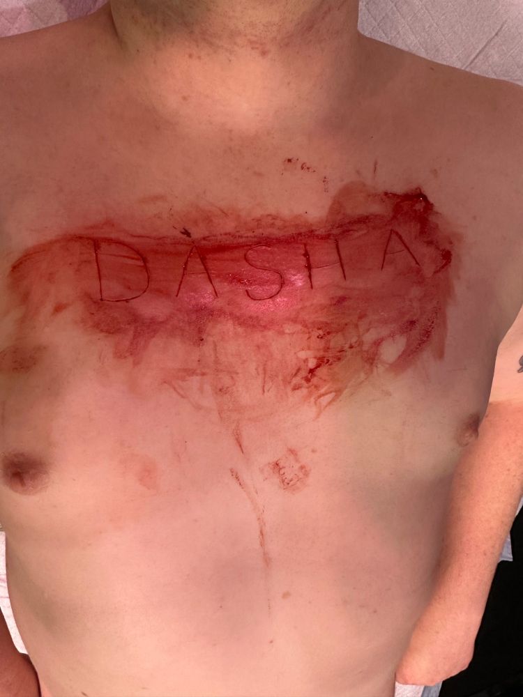 Dasha carved into a chest consensually  