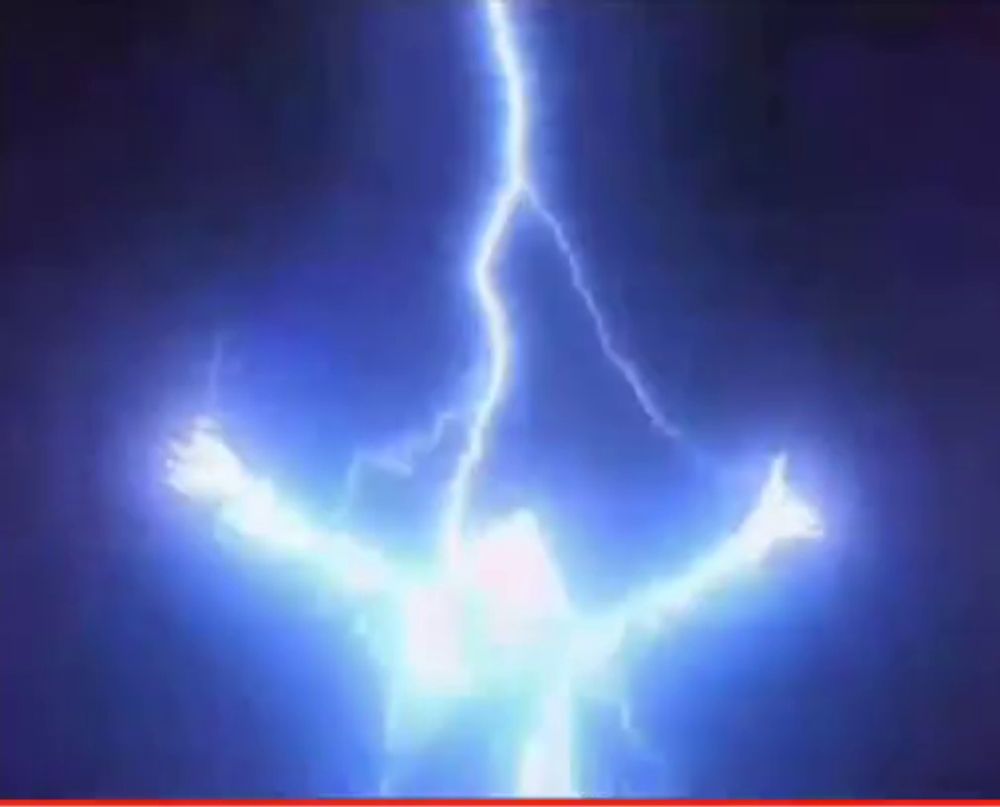 a person is being struck by lightning in the dark