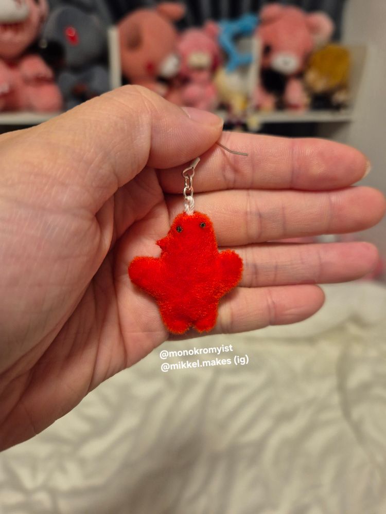 an image of the user's handmade plush earring of marcille's familiar from dungeon meshi. below it is the user's watermark 