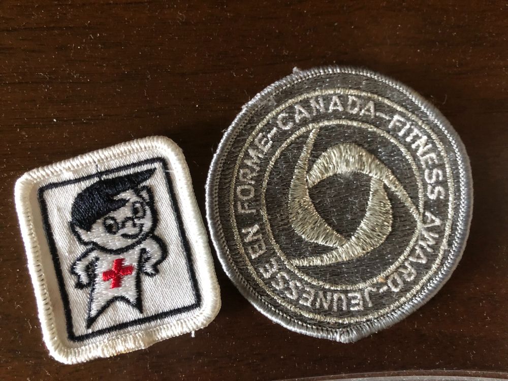 Canadian Red Cross swimming badge and a Canada Fitness Award badge
