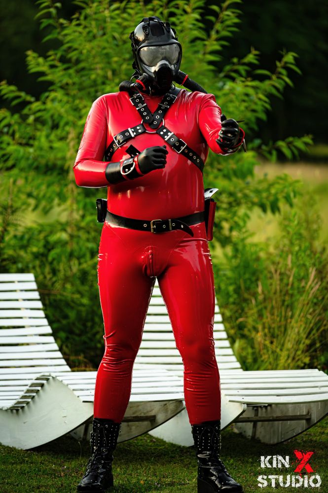 Me Outdoor in my red rubber suit and gasmask attached to bubbler bottles on my back on a harness