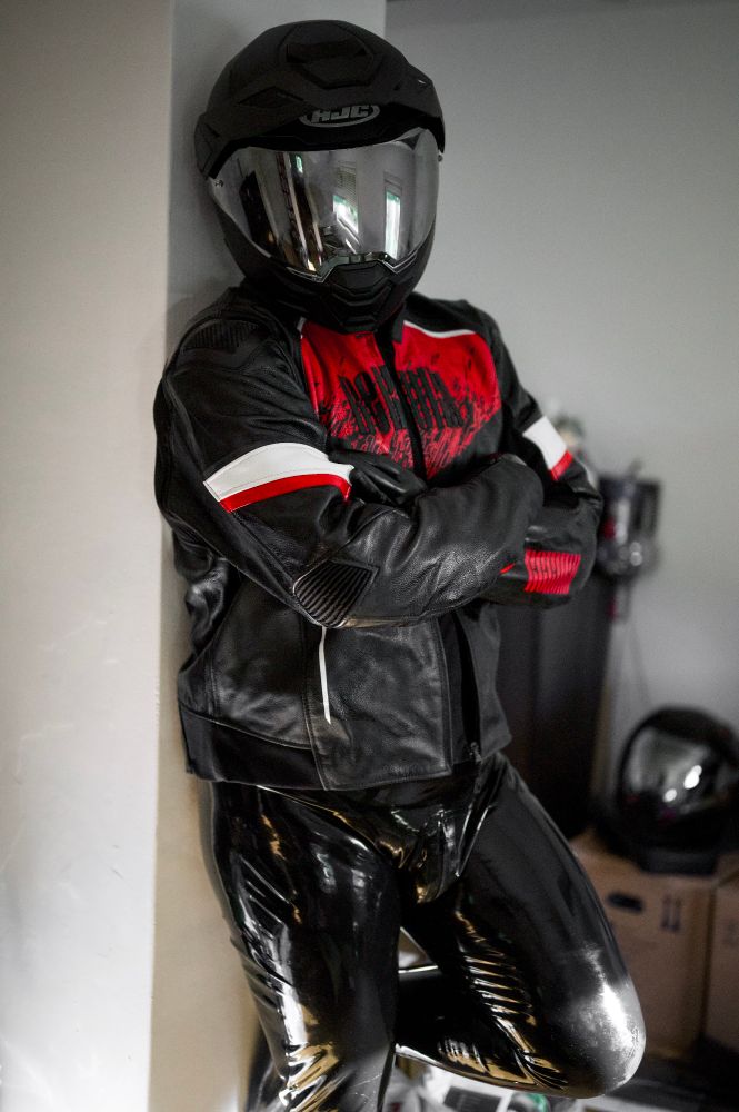 Me wearing a full rubber suit under a biker leather jacket and a mirror tinted helmet 
