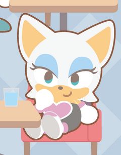 A close up screenshot from a promotional image from the Sonic & Friends x and Gallery event in Japan. It features a chibi style Rouge the Bat sitting at a table with a drink on it. 
