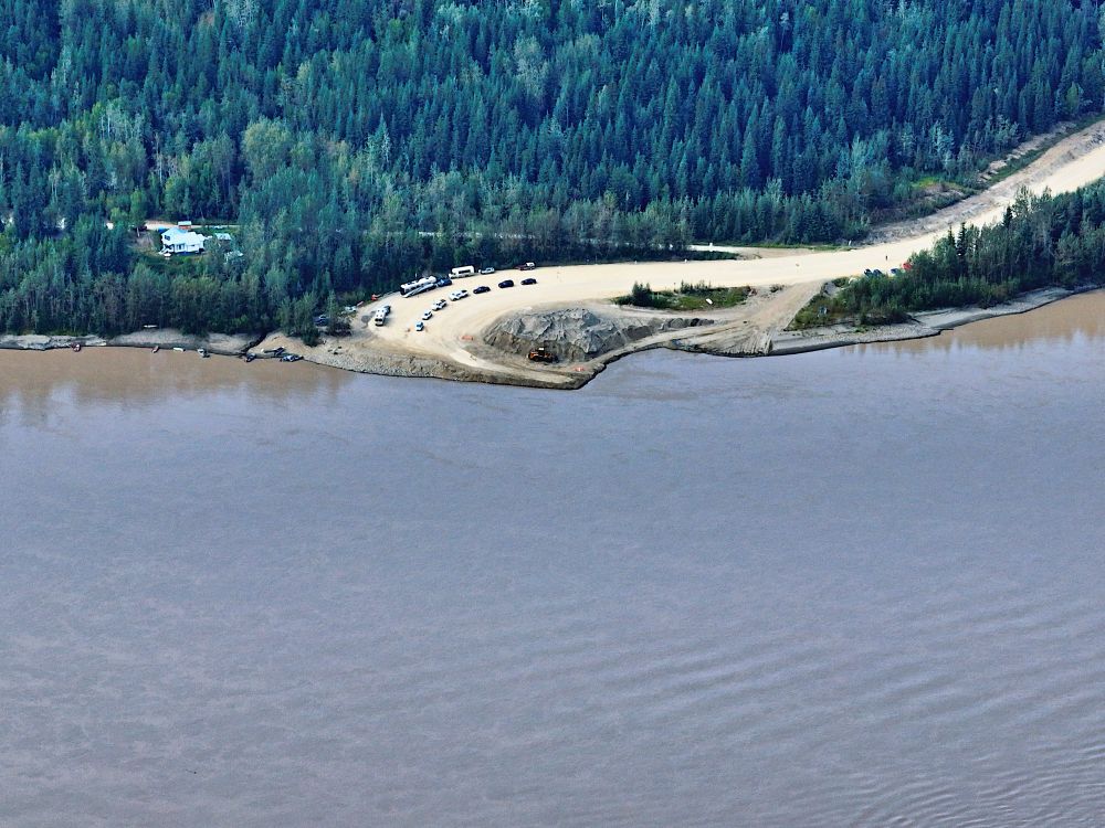 An aerial view shows a river ferry landing. 