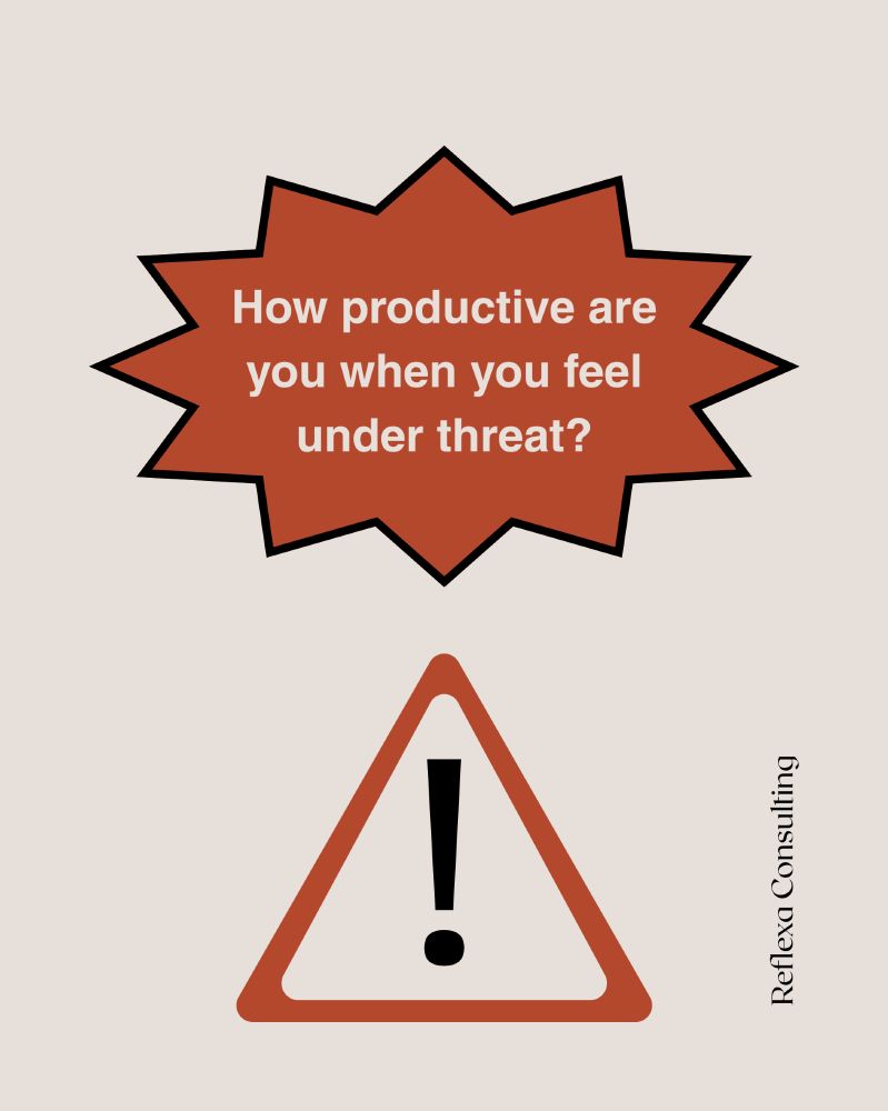 Image shows a warning sign with an exclamation point. Text reads: how productive are you when you feel under threat? 
