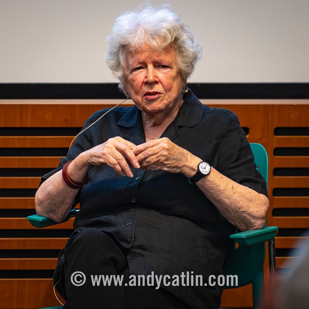 A photographer discussing their work in a lecture theatre