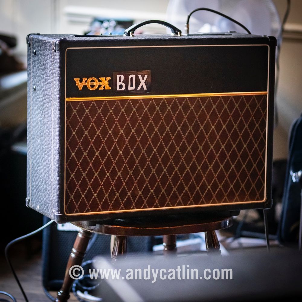 A guitar amplifier with the words 'Vox Box' written on it