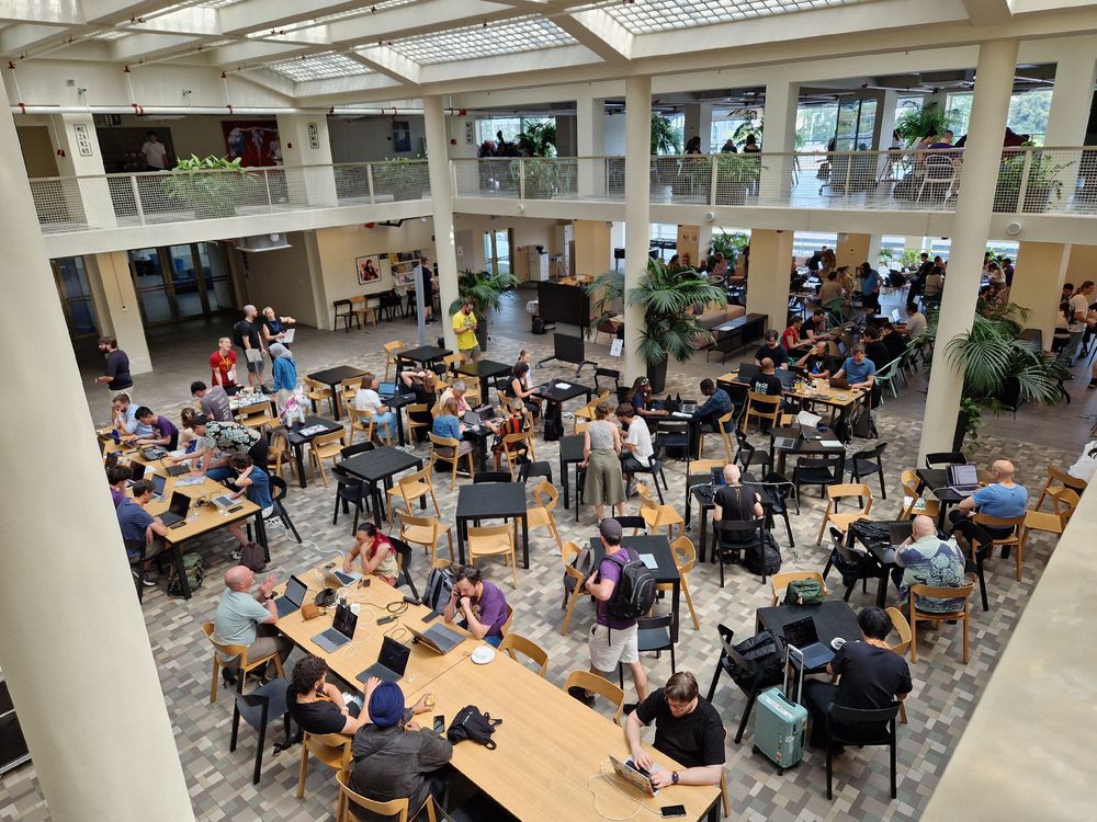 Looking down on many tables of sprinters. 