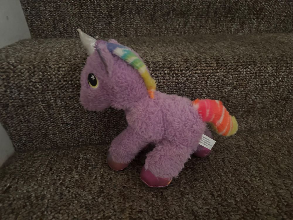 Even though this unicorn stuffie is big to a ferret Geralt carries it around and snuggles next to it like a body pillow